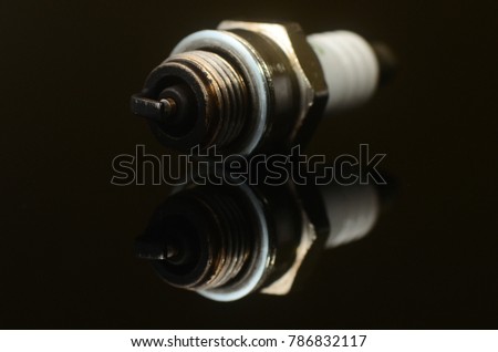 oily, rusted and weathered car spark plug closeup photo