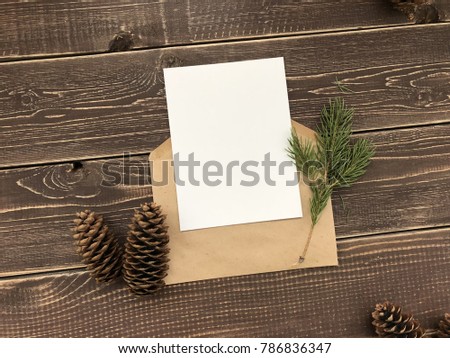 Beautiful background for lettering. Postcard in the New Year style in the branches of a Christmas tree, cones and watercolors