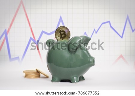 Bitcoin with graph and gold coins in background piggy bank stock market crypto currency coins news 