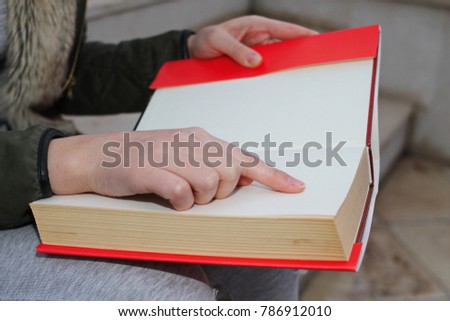 A girl with a book in her hand