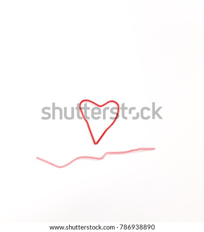 Valentine day concept - soft focus hand made heart-shaped red color paper clip on white background. 