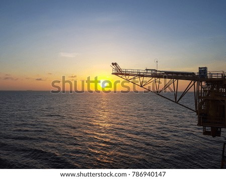 Offshore Remote Platform with sunset background, Oil and Gas 
