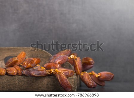 fresh harvested dates on a grey background