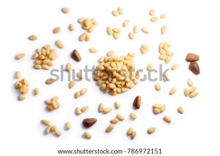 Pine nuts, pignoli (seeds of Pinus sibirica), single, in piles, shelled. Clipping paths, shadows separated, top view. Paths: https://goo.gl/qDEiXX Royalty-Free Stock Photo #786972151