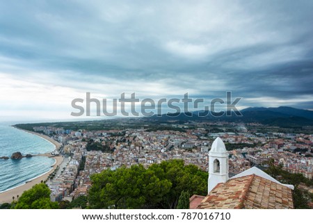 Top view of the central part of Blanes from the fortress of San Juan in cloudy weather (Spain, Catalonia)