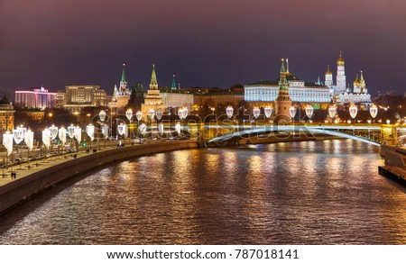 Wide angle landscape view of night Kremlin and Moskva river with Christmas illuminated decorations