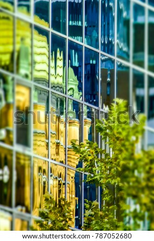 Queen Victoria Building reflected in modern glass high rise building, Sydney city center, Australia.
Abstract reflections of green dome of historic Sydney building in glass facade of office building. Royalty-Free Stock Photo #787052680