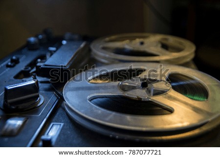 Old tape recorder is playing music, close up