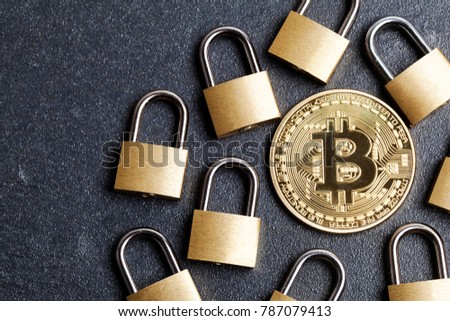 bitcoin security concept. Gold coin with padlock Royalty-Free Stock Photo #787079413