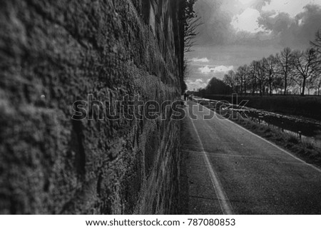 Monochrome Brick wall stone background - texture for continuous rocks