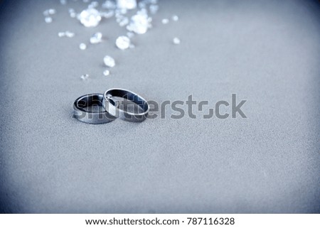 Pair Of Wedding Rings are elegantly displayed. Background Sweet Love Template with copy space for the Valentine's Day Concept banner. 
