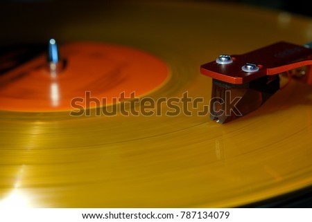 Record player turntable needle cartridge stylus on colored record