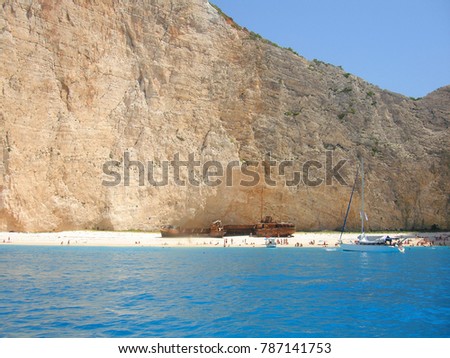 Photo from iconic beach of Navagio with famous shipwreck and turquoise clear waters, Zakynthos island, Ionian, Greece