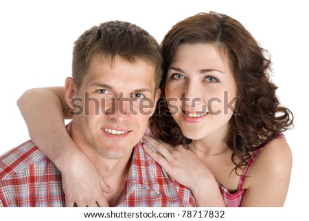 Portrait of a young couple in love. Isolated on white.