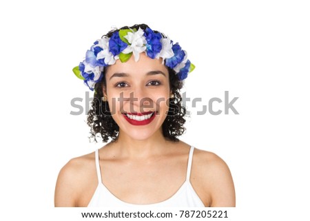 Girl with a big smile. Black woman is wearing a wreath in her hair. She is dressed for the Carnival party in Brazil. Concept of lightness and freshness, New Year's Eve.
