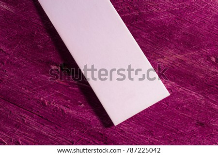 textile label, white cardboard business card
