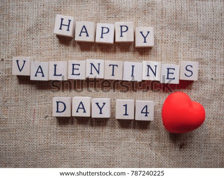 Top view image of valentines day written in letter beads on sack background / with copy space - top view
