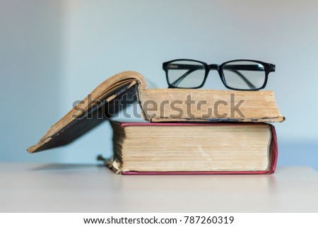 Old books and glasses