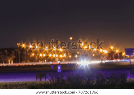 blurred abstract night lighting of vehicle in city 