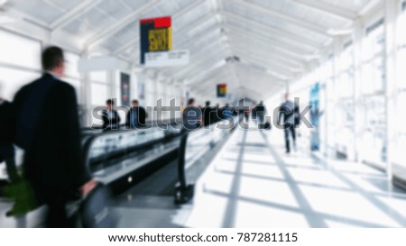 blurred business commuters walking on staircases on a airport