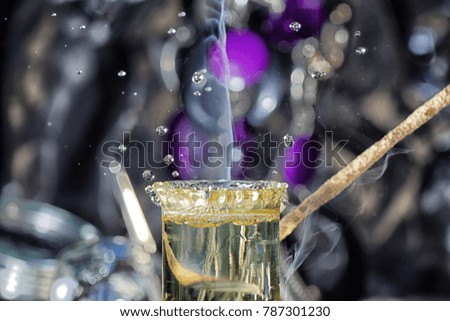 Colorful picture with several drops of water over a test tube