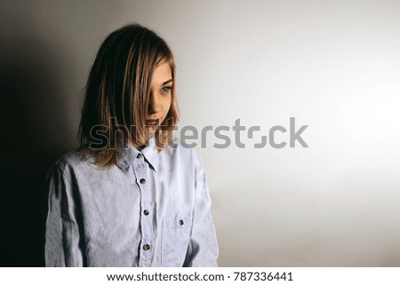 Caucasian redhead Teenager girl fashion photo with emotion and lots of copy space