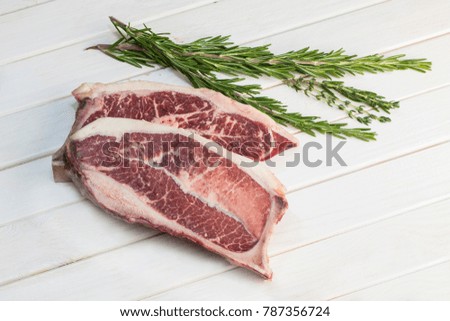 steak on bones with herbs