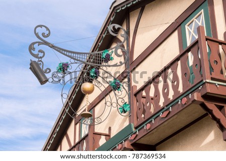 Hanging Wine and Beer Sign on Bavarian Style Pub Restaurant