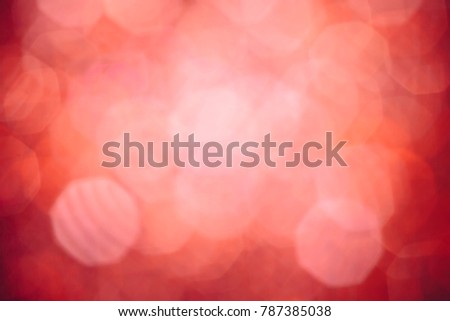 Abstract red blurred lights background with vignetting and bright centre