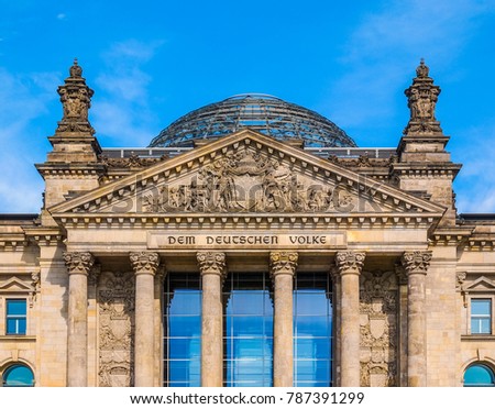 Reichstag houses of parliament in Berlin, Germany - Dem Deutschen Volke means To The German People Royalty-Free Stock Photo #787391299