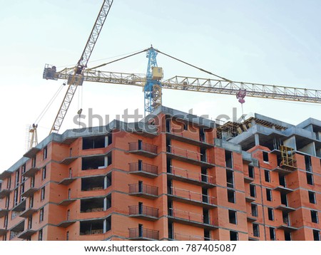 Red brick building under construction. Construction site. Building site.