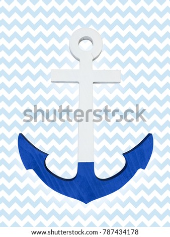Wooden painted anchor on a blue background