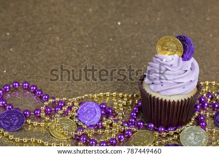 Mardi Gras Cupcakes on a Gold Glitter Background