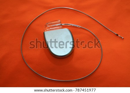 Soft and blurry image:Pacemaker implantation,Cardiac Resynchronization on orange background