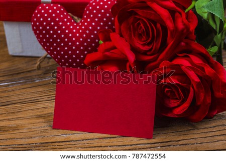 Rose and present gift on wooden background/ Valentines day background