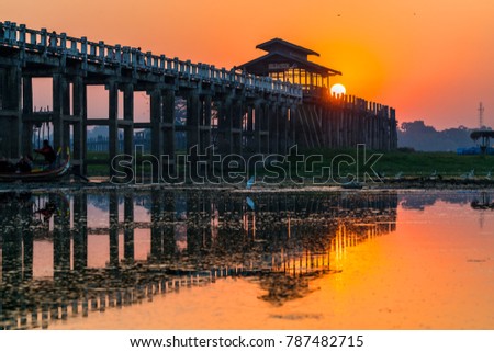 Royalty high quality free stock image of silhouettes of people on Bridge U-Bein teak bridge is the longest. in Amarapura ,Mandalay ,Myanmar
