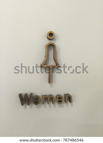 Women restroom sign with elegant design.