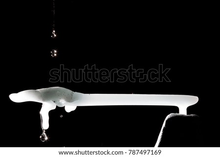 Dripping wax on horizontal bar shaped figure.