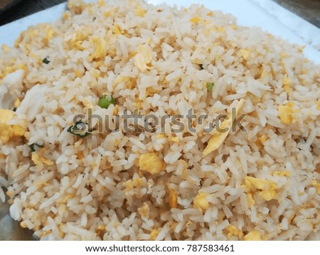 Close up picture of Thai food, fried rice with egg.