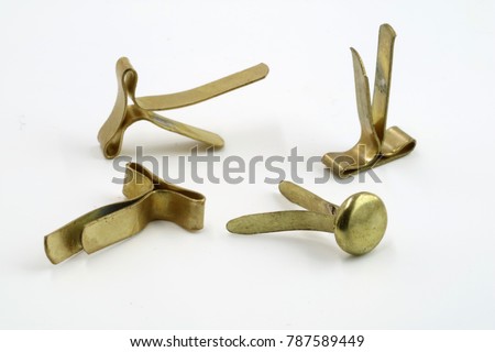 different golden paper clips isolated on white background Royalty-Free Stock Photo #787589449