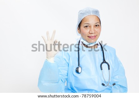 Asian doctor give you an ok gesture, closeup portrait on white background.