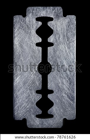 Brushed silver metal razor blade. Royalty-Free Stock Photo #78761626