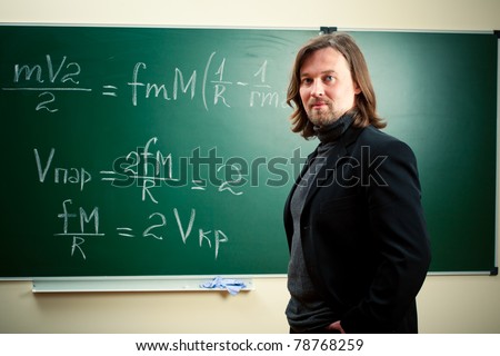 math teacher against the blackboard