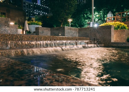 Vivid Shot of Park Fountain with Flowing Water