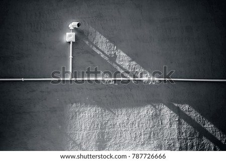 Close up of cctv camera on the wall.