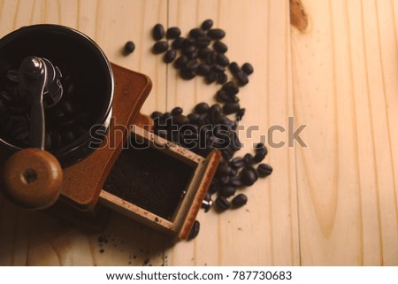 still life with coffee beans and Coffee grinder on the wooden background