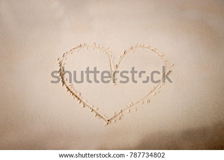 Sand marks on the heart, in the concept of superficial image. For Valentine's Day