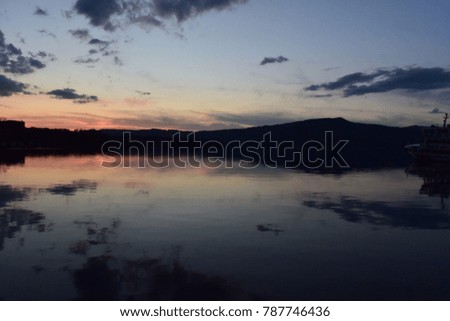 Beautiful Lake as a Spiritual hot spot having a reflection at sunset time. (Location; Lake Akan in Akan National park, Hokkaido, Japan) 