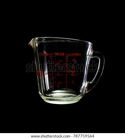 Measuring cup isolated on black background
