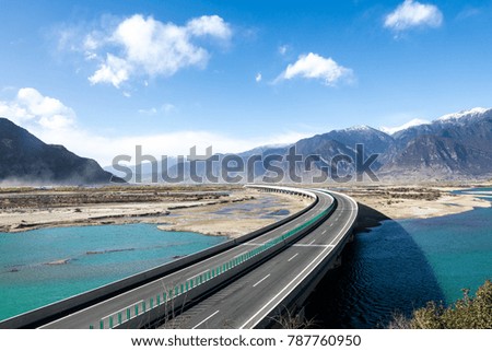 Tibet highway and snow-capped mountains